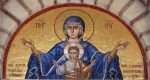Colourful mosaic hagiography of Mother of God ,on the facade above the entrance of the church of Panagia Giatrissa in Loutraki, Greece
