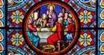 Basel Cathedral Minster. Stained glass window. The Last Supper is the final meal that Jesus shared with his Apostles. Basel, Switzerland - December 2022