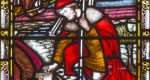 LONDON, GREAT BRITAIN - SEPTEMBER 19, 2017: The Parable of the Hidden Treasure on the stained glass in St Mary Abbot's church on Kensington High Street.